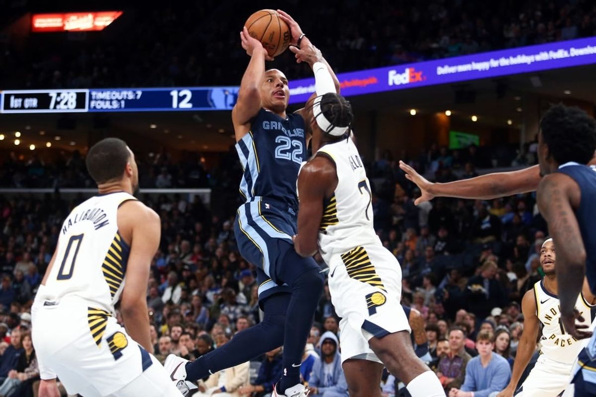 Dec 21, 2023; Memphis, Tennessee, USA; Memphis Grizzlies guard Desmond Bane (22) shoots as Indiana Pacers guard Buddy Hield (7) defends during the first half at FedExForum.