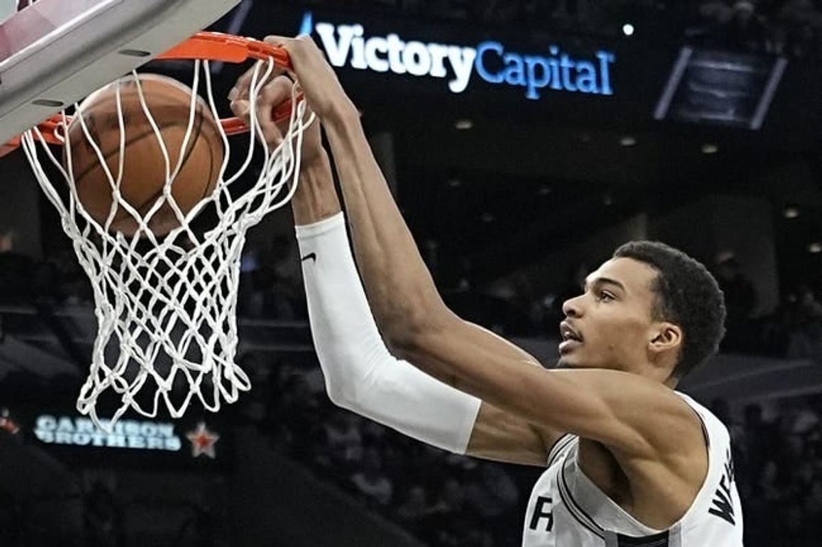 Dec 17, 2023; San Antonio, Texas, USA; San Antonio Spurs forward Victor Wembanyama (1) dunks during the second half against the New Orleans Pelicans at Frost Bank Center.