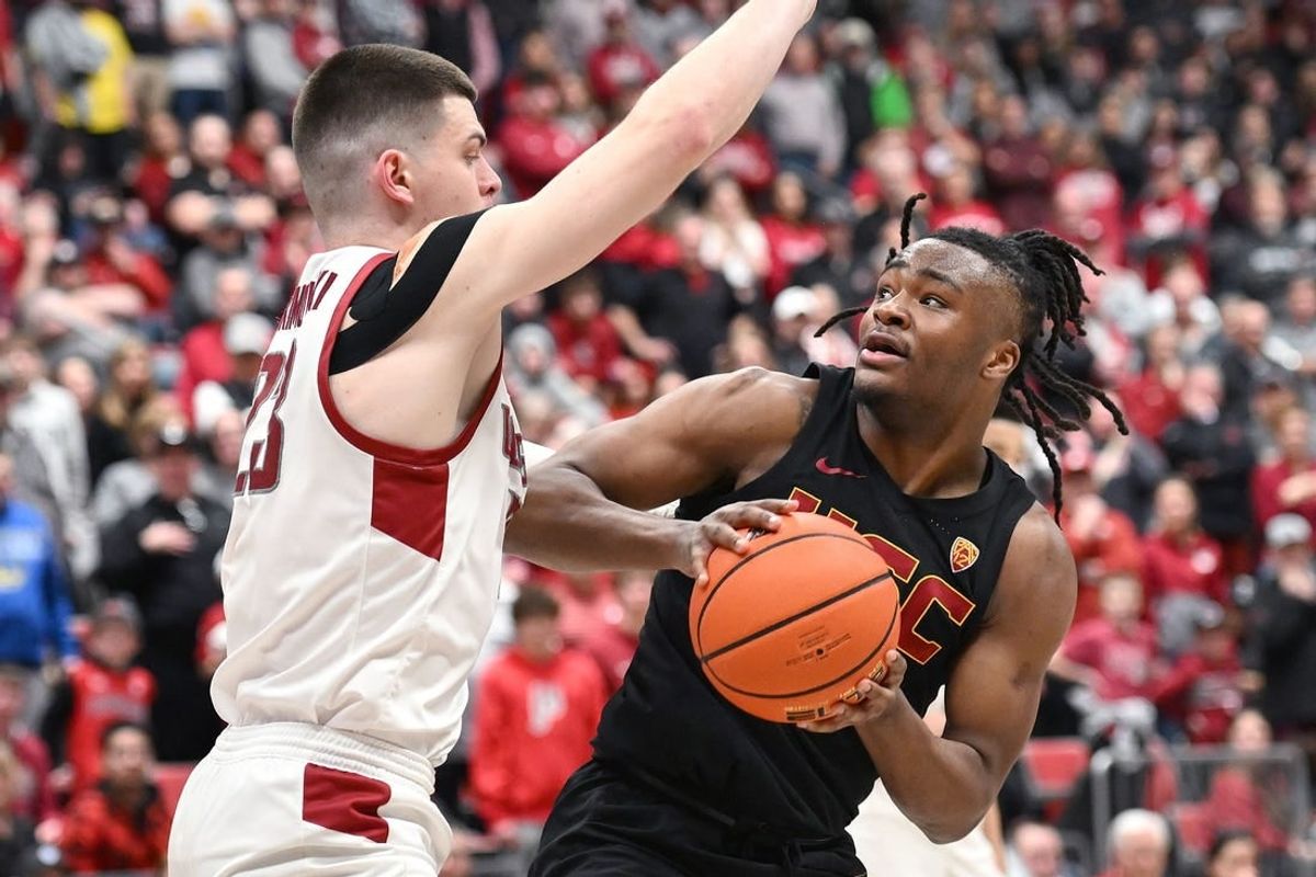 Feb 29, 2024; Pullman, Washington, USA; USC Trojans guard Isaiah Collier (1) shoots the ball againstWashington State Cougars forward Andrej Jakimovski (23) in the second half at Friel Court at Beasley Coliseum. Washington State Cougars won 75-72.