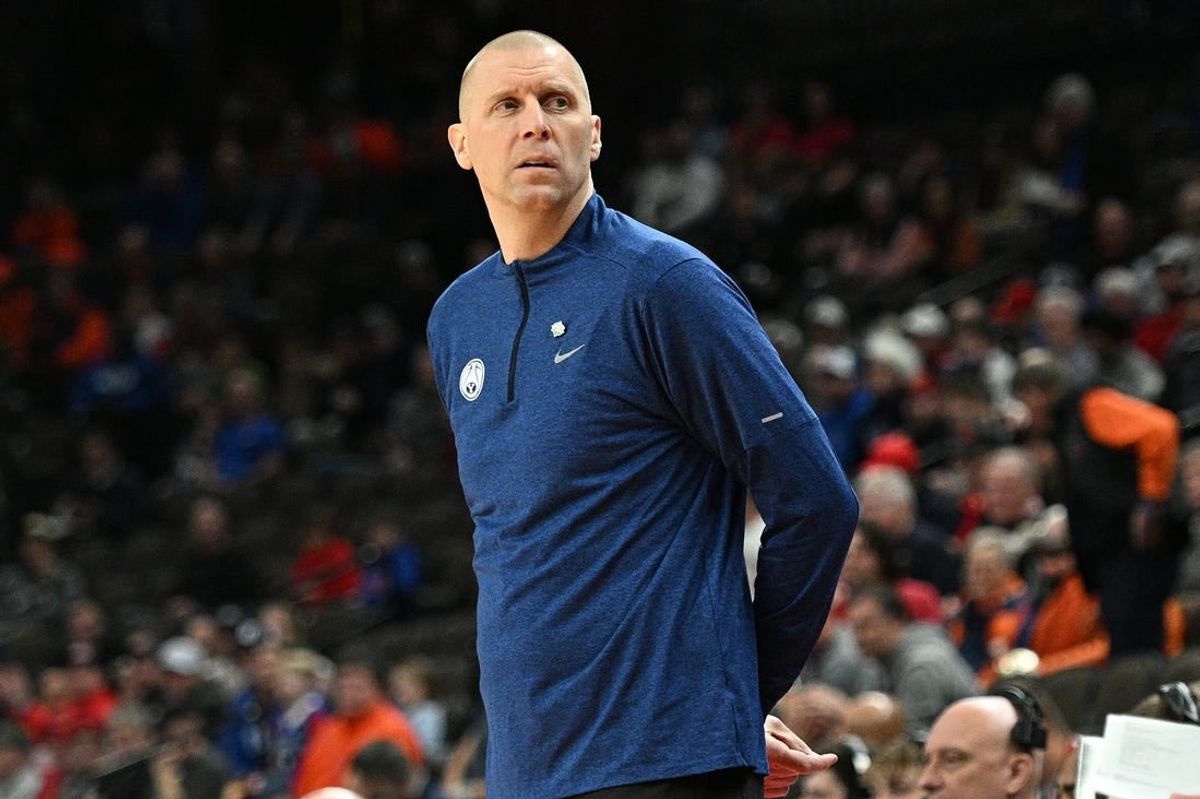 Mar 21, 2024; Omaha, NE, USA; Brigham Young Cougars head coach Mark Pope keeps an eye on the action in the first half Duquesne Dukes during the first round of the NCAA Tournament at CHI Health Center Omaha.