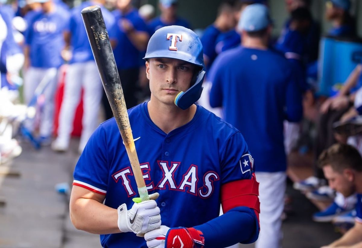 Mar 18, 2024; Surprise, Arizona, USA; Texas Rangers designated hitter Justin Foscue against the Seattle Mariners during a spring training baseball game at Surprise Stadium.