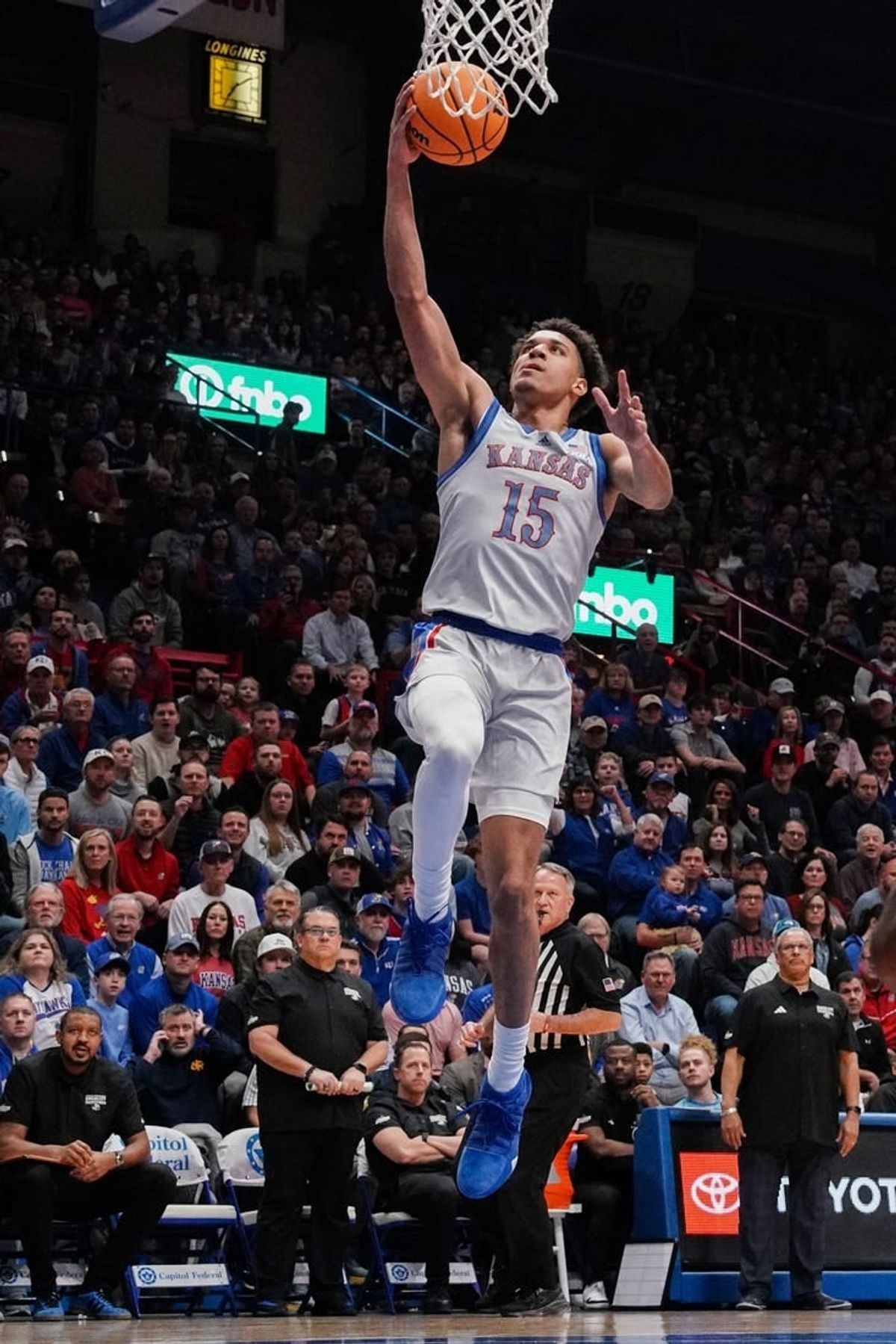 Dec 5, 2023; Lawrence, Kansas, USA; Kansas Jayhawks guard Kevin McCullar Jr. (15) shoots a layup against the UMKC Kangaroos during the first half at Allen Fieldhouse.