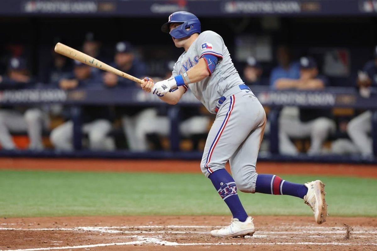Oct 4, 2023; St. Petersburg, Florida, USA; Texas Rangers third baseman Josh Jung (6) hits a ground rule double against the Tampa Bay Rays in the sixth inning during game two of the Wildcard series for the 2023 MLB playoffs at Tropicana Field.