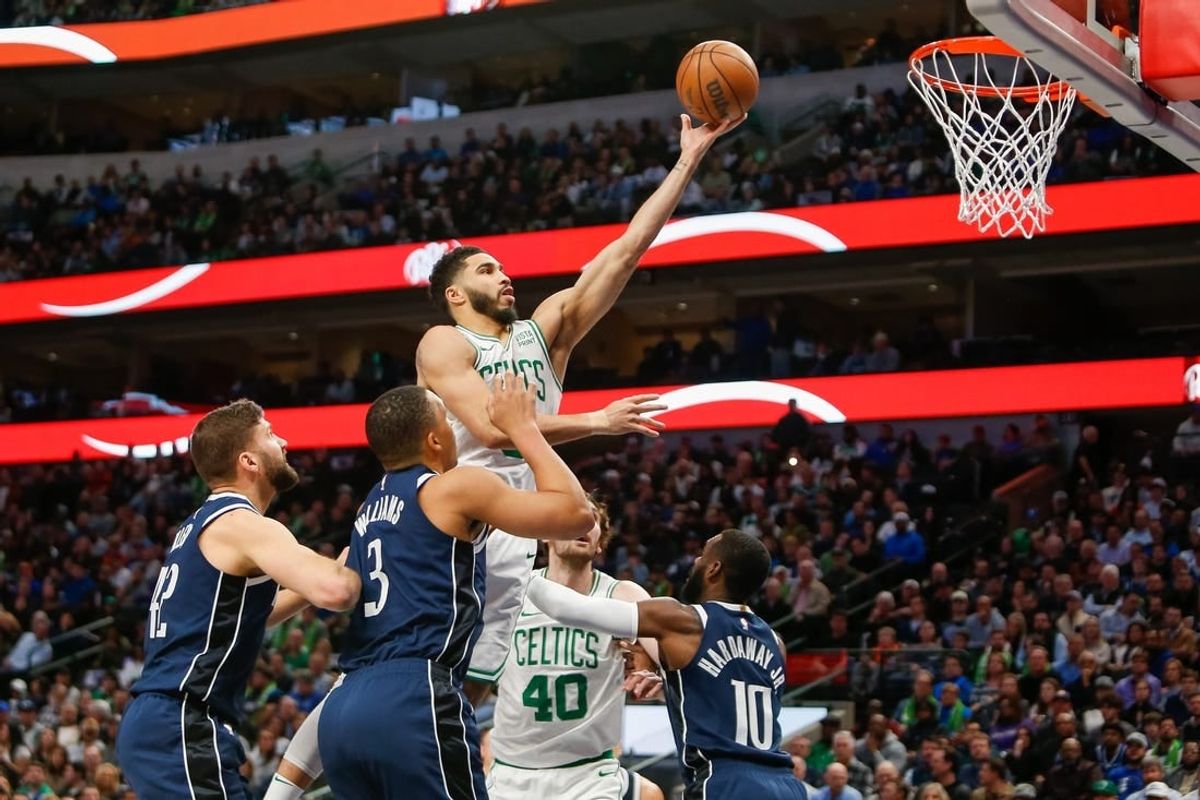 Jan 22, 2024; Dallas, Texas, USA; Boston Celtics forward Jayson Tatum (0) shoots during the first quarter against the Dallas Mavericks at American Airlines Center.