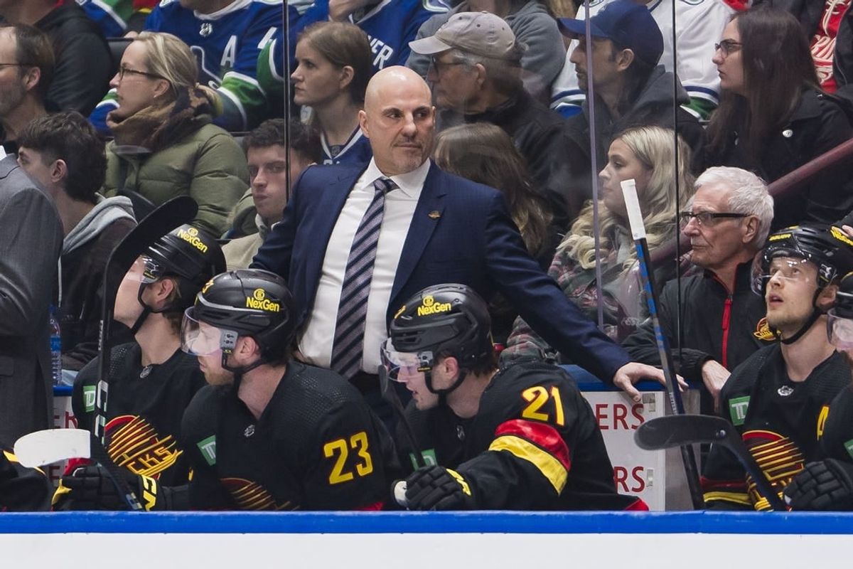 Feb 15, 2024; Vancouver, British Columbia, CAN; Vancouver Canucks head coach Rick Tocchet on the bench against the Detroit Red Wings in the first period at Rogers Arena.
