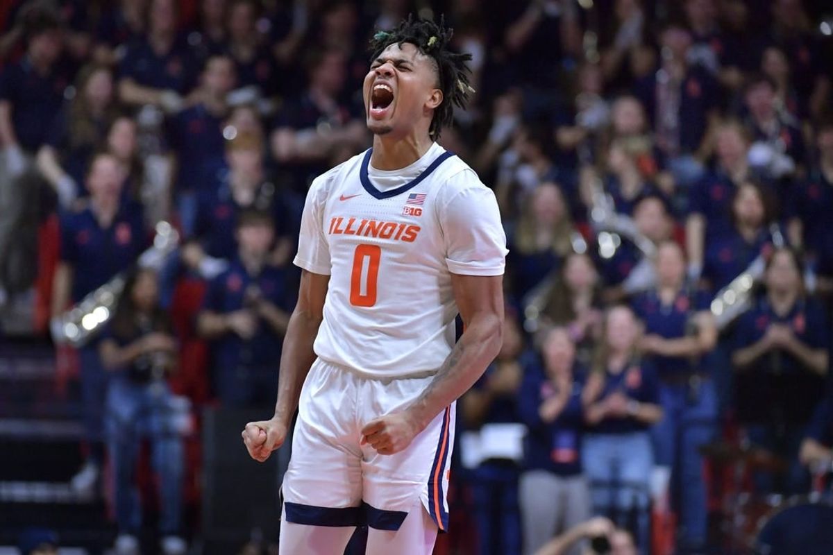 Jan 21, 2024; Champaign, Illinois, USA; Illinois Fighting Illini guard Terrence Shannon Jr. (0) reacts after scoring during the second half against the Rutgers Scarlet Knights at State Farm Center.