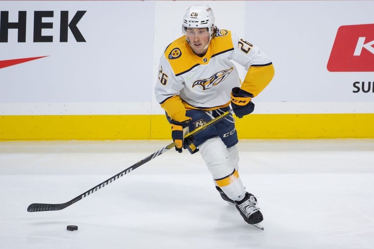 Jan 29, 2024; Ottawa, Ontario, CAN; Nashville Predators center Philip Tomasino (26) controls the puck in the third period against the Ottawa Senators at the Canadian Tire Centre.
