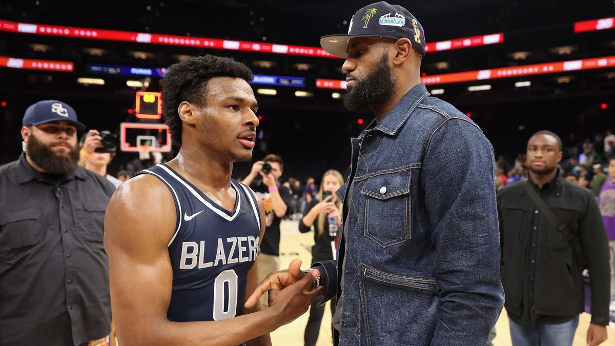 LeBron James greets son Bronny after a high school tournament in 2021.