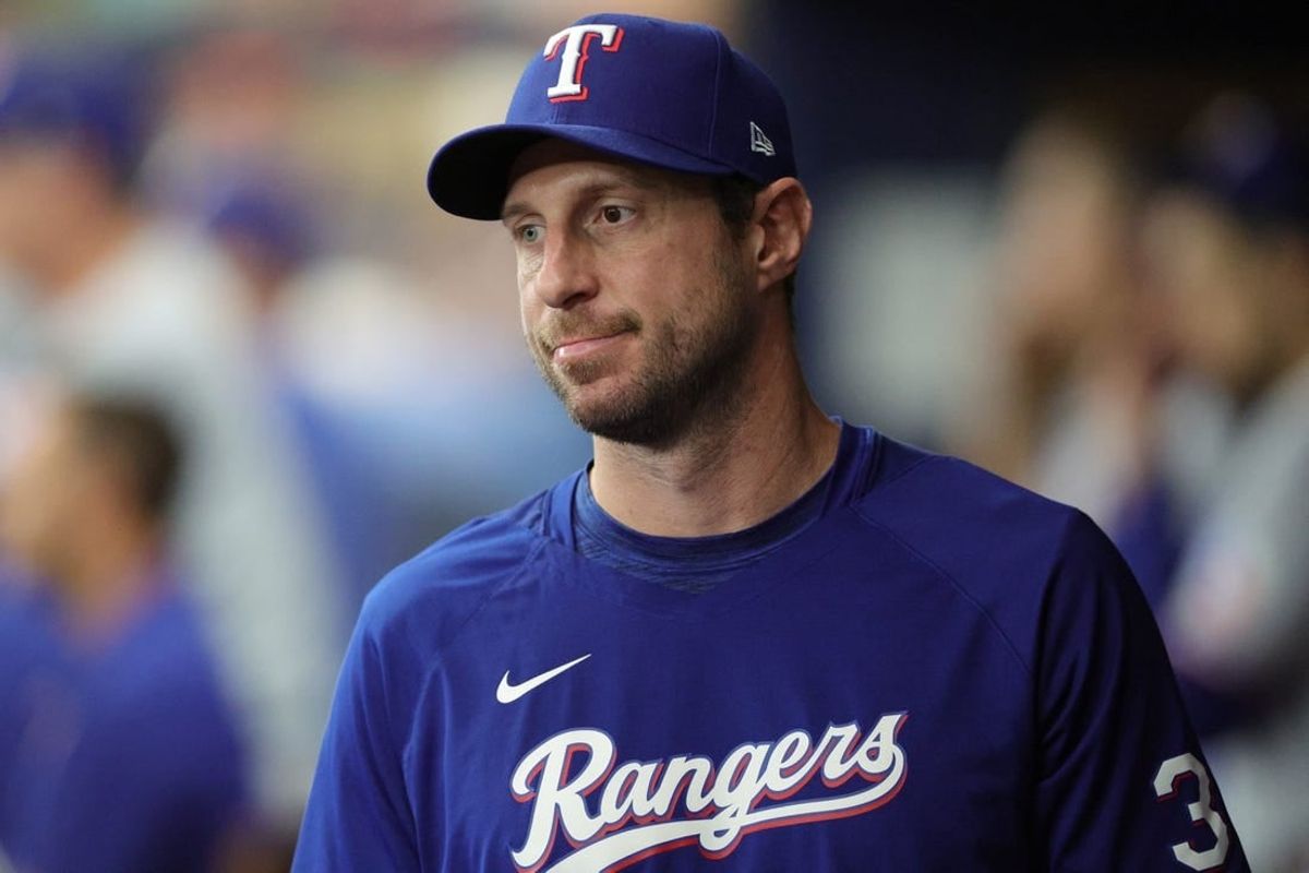 Oct 4, 2023; St. Petersburg, Florida, USA; Texas Rangers starting pitcher Max Scherzer (31) is seen in the dugout during game two of the Wildcard series for the 2023 MLB playoffs against the Tampa Bay Rays at Tropicana Field.