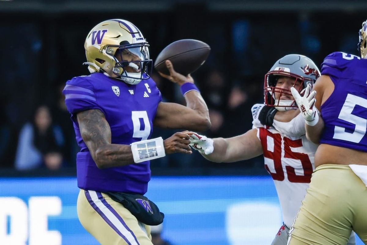 Nov 25, 2023; Seattle, Washington, USA; Washington Huskies quarterback Michael Penix Jr. (9) passes against the Washington State Cougars during the first quarter at Alaska Airlines Field at Husky Stadium.