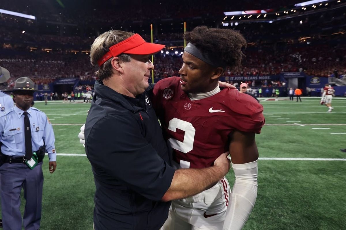 Dec 2, 2023; Atlanta, GA, USA;  Georgia Bulldogs head coach Kirby Smart embraces Alabama Crimson Tide defensive back Caleb Downs (2) after the SEC championship game at Mercedes-Benz Stadium.