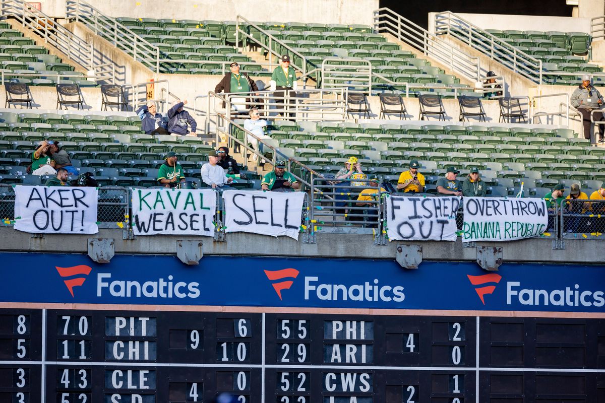 Fans protest Oakland ownership during the Major League Baseball game between the Tampa Bay Rays and the Oakland Athletics
