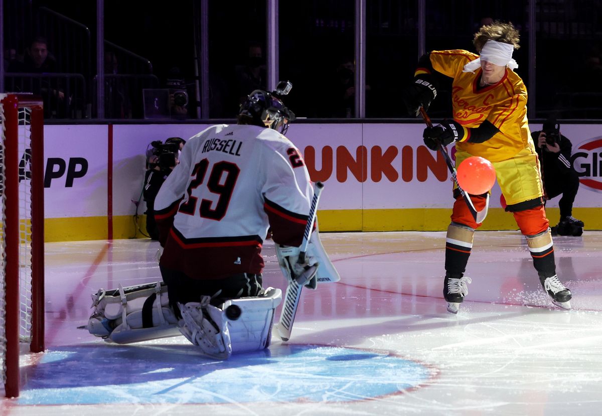 Anaheim Ducks rookie Trevor Zegras shoots while dodging dodgeballs, blindfolded.