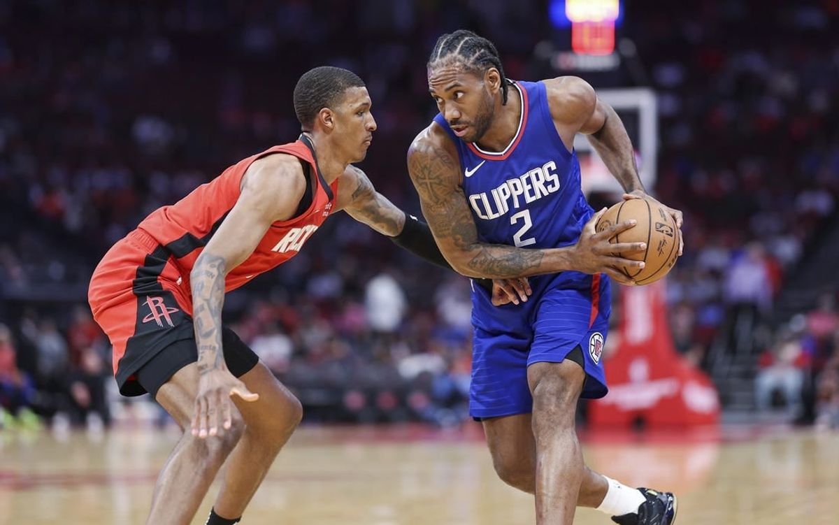Mar 6, 2024; Houston, Texas, USA; Los Angeles Clippers forward Kawhi Leonard (2) controls the ball as Houston Rockets forward Jabari Smith Jr. (10) defends during the first quarter at Toyota Center.