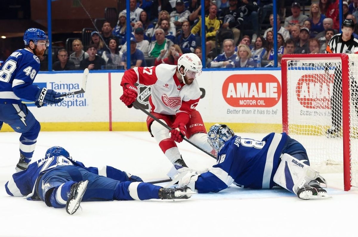 Apr 1, 2024; Tampa, Florida, USA;Tampa Bay Lightning goaltender Andrei Vasilevskiy (88) makes a save from Detroit Red Wings center Michael Rasmussen (27) during the second period at Amalie Arena.