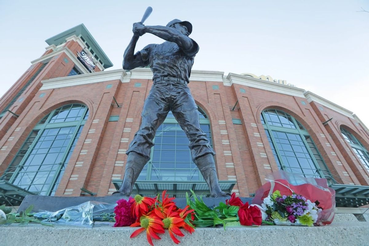Flowers and momentous are laid at a makeshift memorial in front of the Henry Aaron statue at American Family Field Saturday, Jan. 23, 2021 in Milwaukee. Aaron, who began and ended his big-league career in Milwaukee and was known as \"Hammerin' Hank\" for his successful pursuit of Babe Ruth's cherished home run record, died early Friday, Jan. 22, 2021 in his sleep at age 86.

American Family Field 10