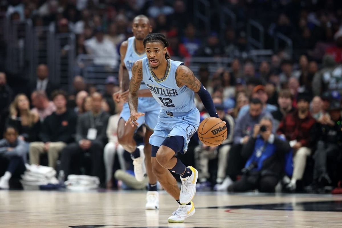 Dec 29, 2023; Los Angeles, California, USA;  Memphis Grizzlies guard Ja Morant (12) dribbles the ball during the first quarter against the Los Angeles Clippers at Crypto.com Arena.