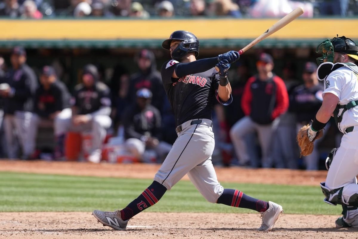 Mar 30, 2024; Oakland, California, USA; Cleveland Guardians center fielder Tyler Freeman (2) hits an RBI single against the Oakland Athletics during the sixth inning at Oakland-Alameda County Coliseum.