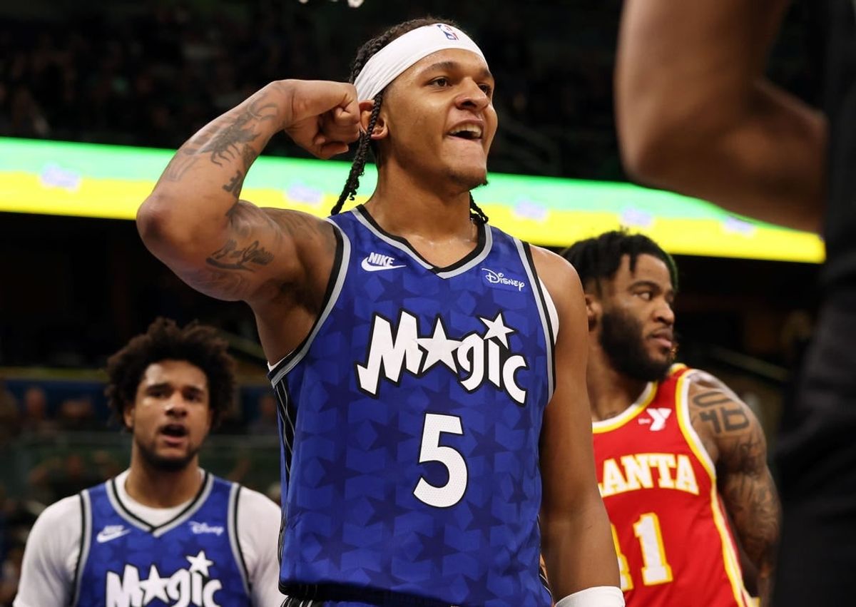 Jan 7, 2024; Orlando, Florida, USA; Orlando Magic forward Paolo Banchero (5) celebrates after he made  basket  against the Atlanta Hawks during overtime at Kia Center.