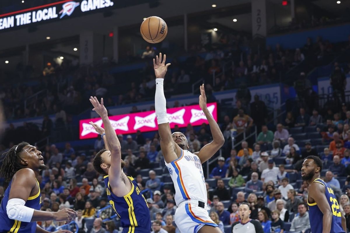 Dec 8, 2023; Oklahoma City, Oklahoma, USA; Oklahoma City Thunder guard Shai Gilgeous-Alexander (2) shoots against Golden State Warriors guard Stephen Curry (30) during the first quarter at Paycom Center.