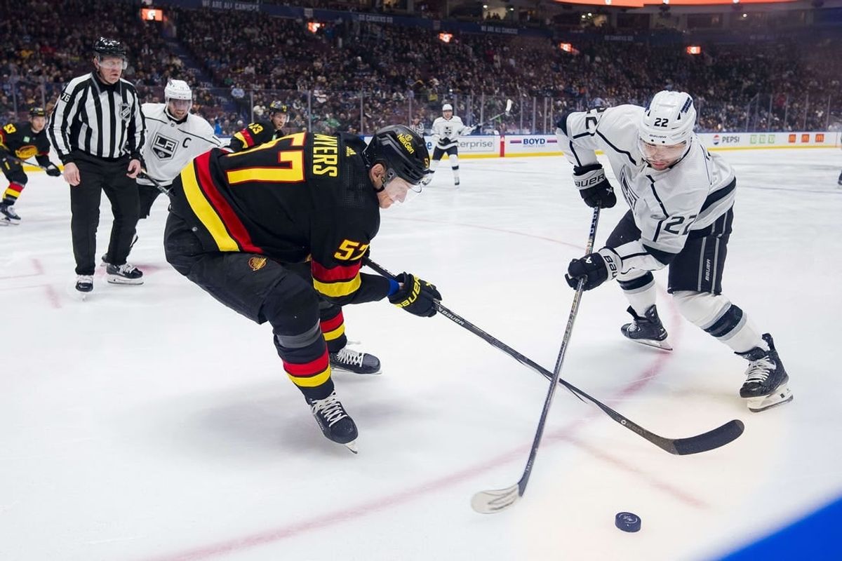 Feb 29, 2024; Vancouver, British Columbia, CAN; Vancouver Canucks defenseman Tyler Myers (57) battles with Los Angeles Kings forward Kevin Fiala (22) in the first period at Rogers Arena.