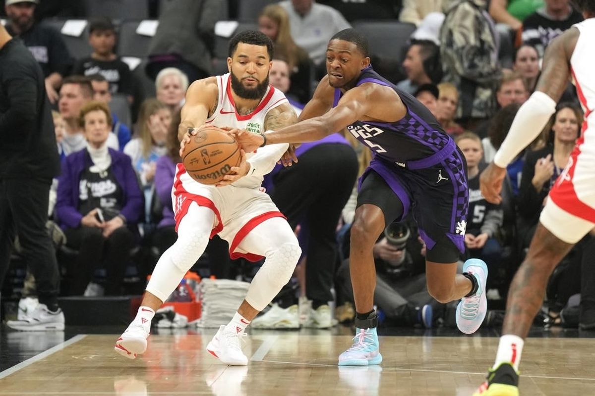 Mar 10, 2024; Sacramento, California, USA; Sacramento Kings guard De'Aaron Fox (right) reaches for a pass to Houston Rockets guard Fred VanVleet (left) during the first quarter at Golden 1 Center.