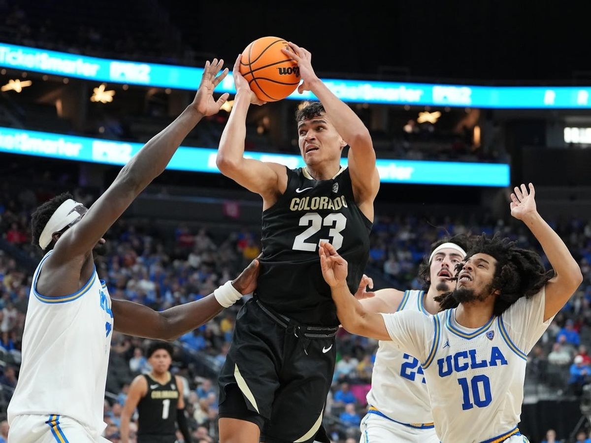 Mar 9, 2023; Las Vegas, NV, USA; Colorado Buffaloes forward Tristan da Silva (23) looks to shoot between UCLA Bruins forward Adem Bona (3) and guard Tyger Campbell (10) during the second half at T-Mobile Arena.