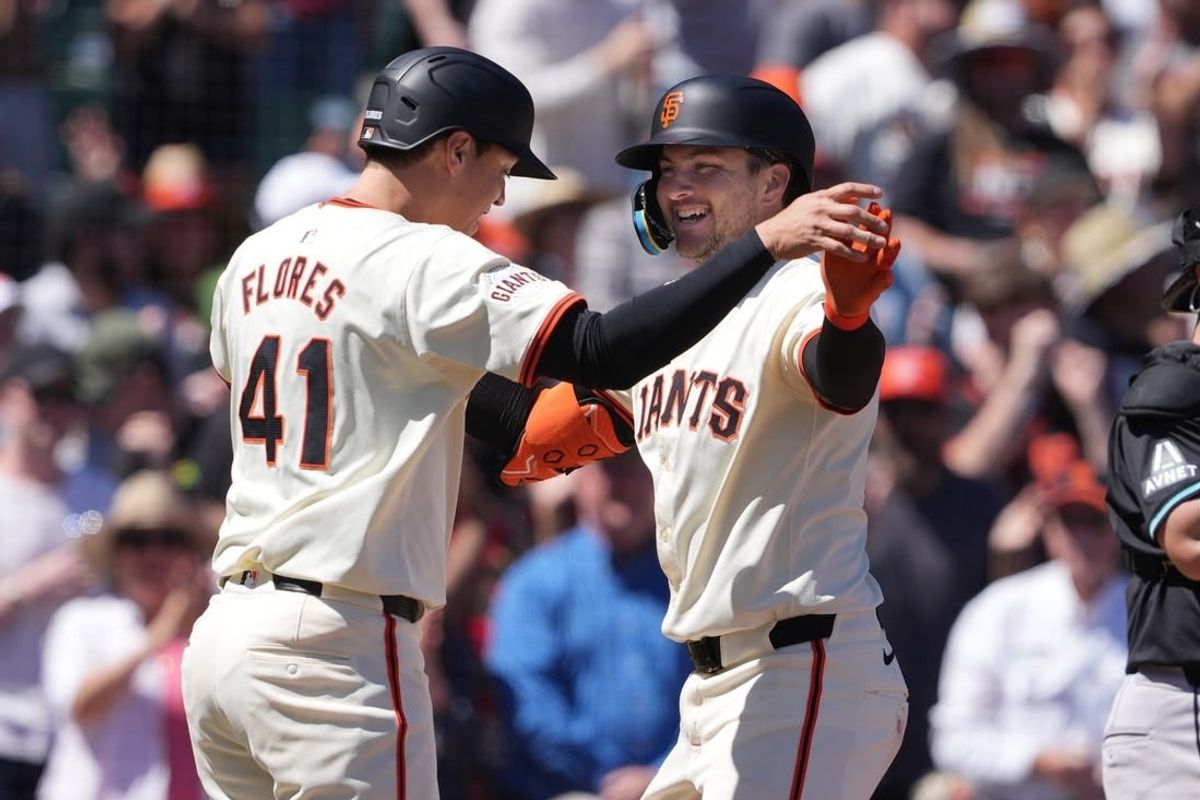Apr 20, 2024; San Francisco, California, USA; San Francisco Giants catcher Patrick Bailey (right) celebrates with third baseman Wilmer Flores (41) after hitting a home run against the Arizona Diamondbacks during the fifth inning at Oracle Park.