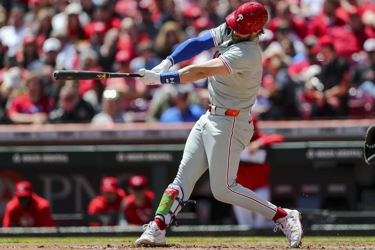 Apr 25, 2024; Cincinnati, Ohio, USA; Philadelphia Phillies first baseman Bryce Harper (3) hits a two-run home run in the third inning against the Cincinnati Reds at Great American Ball Park.