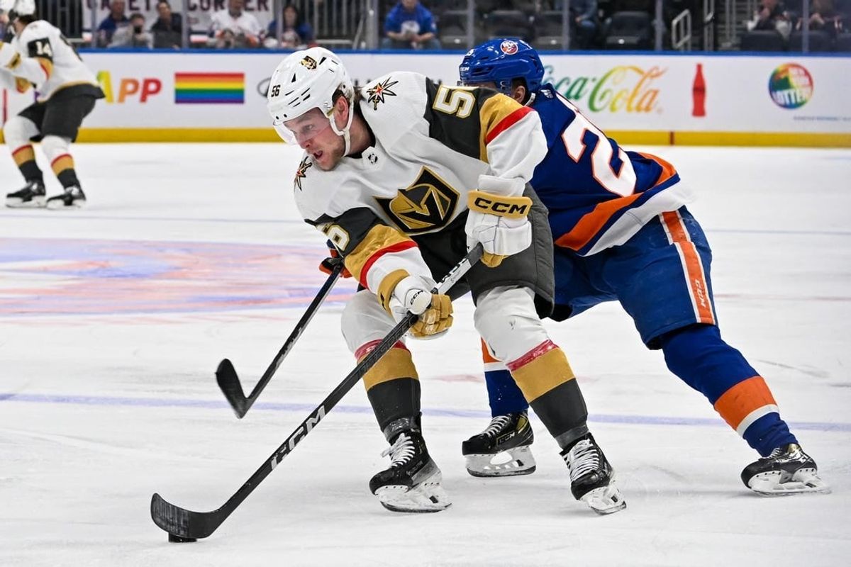 Jan 23, 2024; Elmont, New York, USA;  New York Islanders defenseman Sebastian Aho (25) chases Vegas Golden Knights right wing Sheldon Rempal (56) during the first period at UBS Arena.