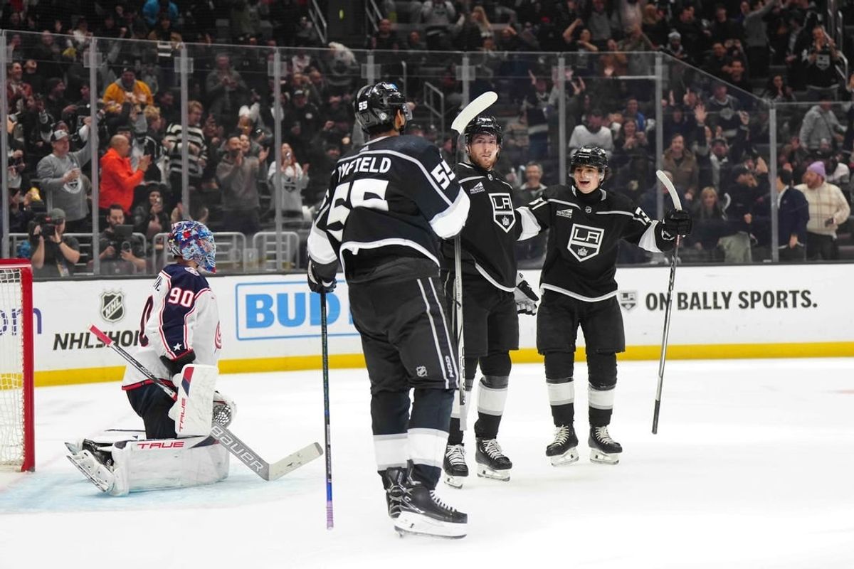 Feb 20, 2024; Los Angeles, California, USA; LA Kings center Pierre-Luc Dubois (80) celebrates after scoring a goal with right wing Quinton Byfield (55) and center Alex Turcotte (38) as Columbus Blue Jackets goaltender Elvis Merzlikins (90) reacts  in the second period at Crypto.com Arena.