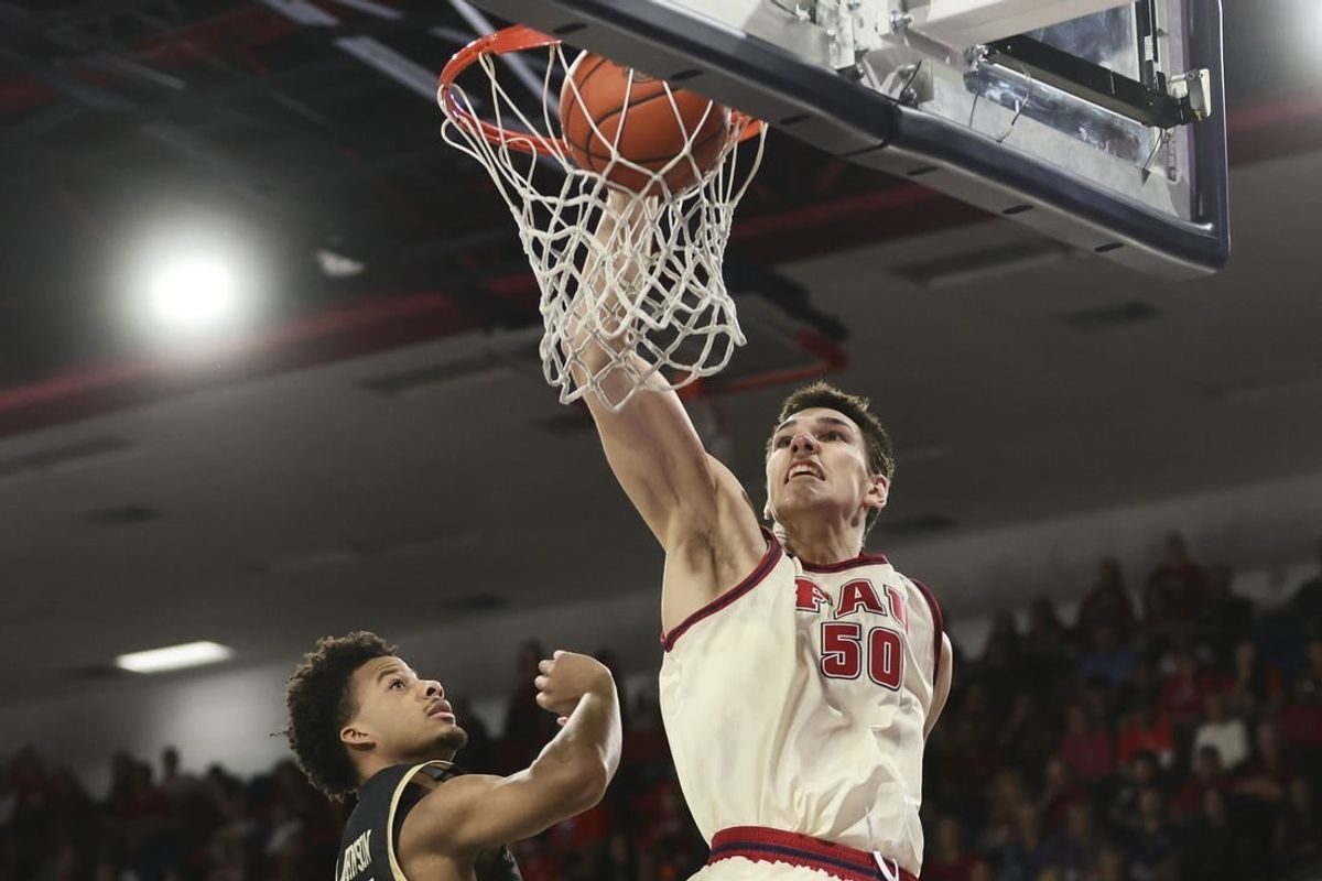 Jan 14, 2024; Boca Raton, Florida, USA; Florida Atlantic Owls center Vladislav Goldin (50) dunks the basketball against the UAB Blazers during the second half at Eleanor R. Baldwin Arena.