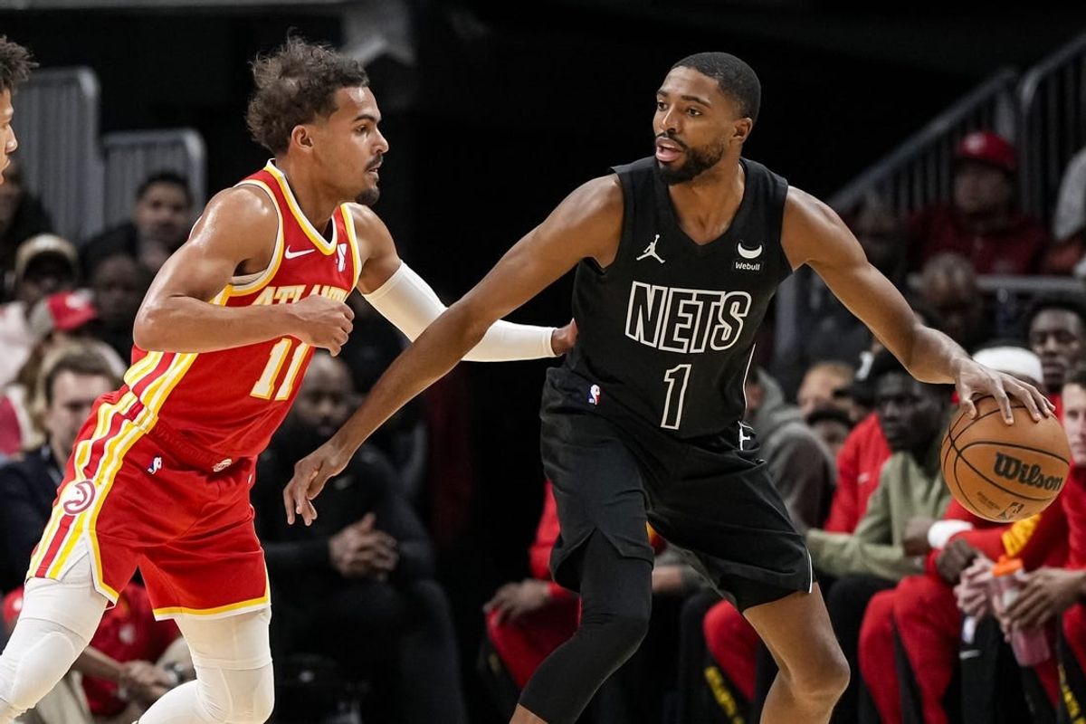 Nov 22, 2023; Atlanta, Georgia, USA; Atlanta Hawks guard Trae Young (11) defends against Brooklyn Nets forward Mikal Bridges (1) during the first half at State Farm Arena.