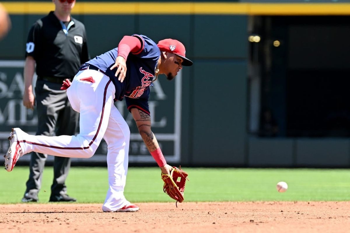 Mar 20, 2024; North Port, Florida, USA; Atlanta Braves shortstop Orlando Arcia (11) fields a ground ball in the second inning of a spring training game against the Toronto Blue Jays  at CoolToday Park.