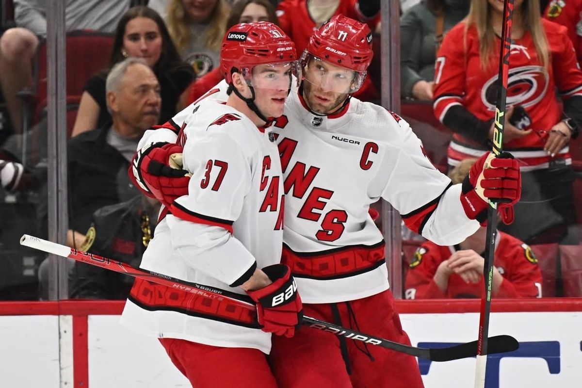 Apr 14, 2024; Chicago, Illinois, USA;  Carolina Hurricanes forward Jordan Staal (11), right, celebrates with forward Andrei Svechnikov (37) after scoring a goal in the second period against the Chicago Blackhawks at United Center.