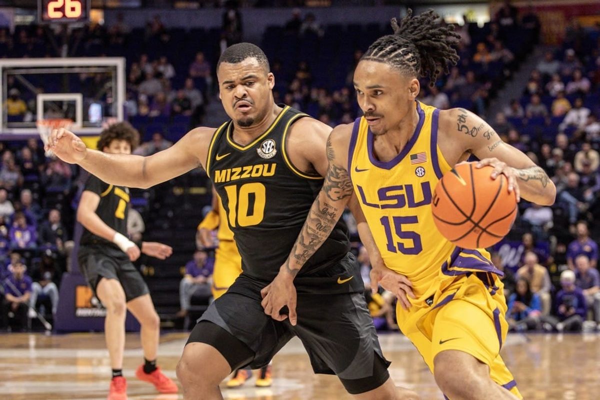 Mar 9, 2024; Baton Rouge, Louisiana, USA; LSU Tigers forward Tyrell Ward (15) brings the ball up court against Missouri Tigers guard Nick Honor (10) during the first half at Pete Maravich Assembly Center.