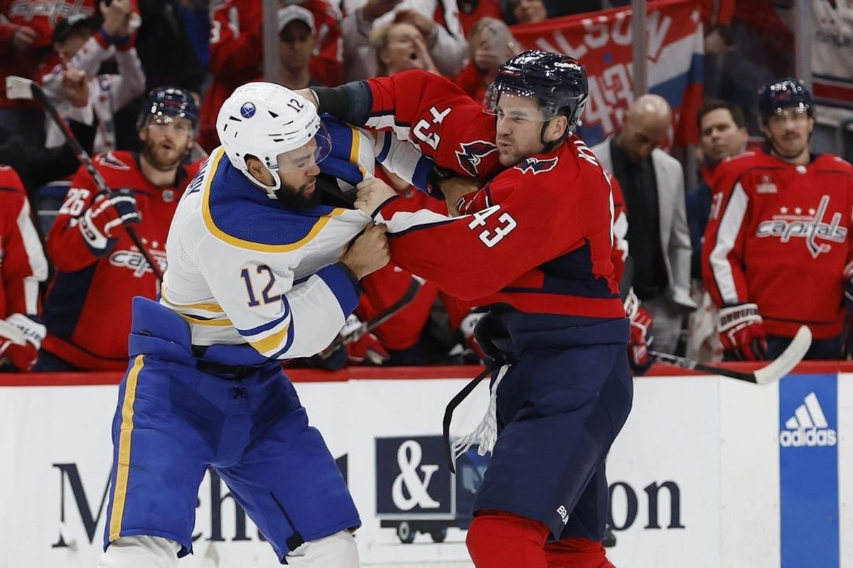 Nov 22, 2023; Washington, District of Columbia, USA; Washington Capitals right wing Tom Wilson (43) fights Buffalo Sabres left wing Jordan Greenway (12) in the first period at Capital One Arena.
