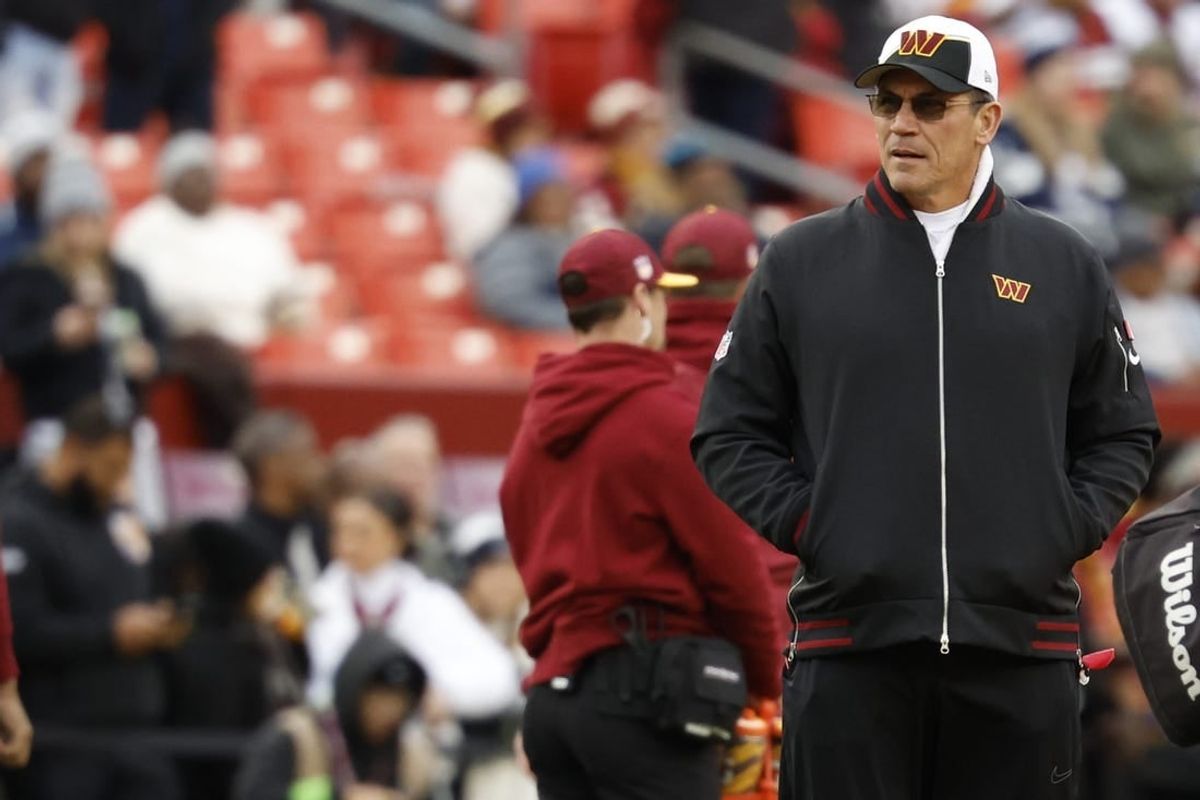 Jan 7, 2024; Landover, Maryland, USA; Washington Commanders head coach Ron Rivera stands on the field during warmups prior to the game against the Dallas Cowboys at FedExField.
