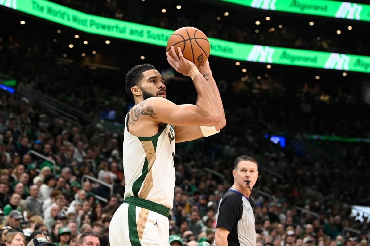 Feb 4, 2024; Boston, Massachusetts, USA; Boston Celtics forward Jayson Tatum (0)  shoots the ball against the Memphis Grizzlies during the first half at TD Garden.
