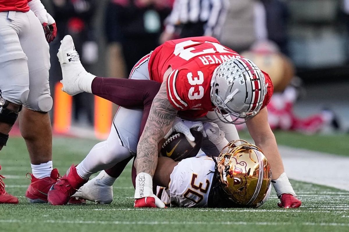 Nov 18, 2023; Columbus, Ohio, USA; Ohio State Buckeyes defensive end Jack Sawyer (33) tackles Minnesota Golden Gophers running back Jordan Nubin (30) during the first half of the NCAA football game at Ohio Stadium.