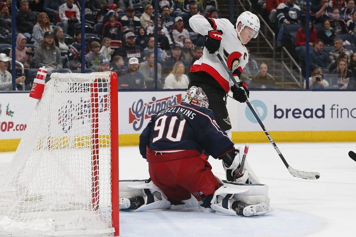 Dec 1, 2023; Columbus, Ohio, USA; Ottawa Senators left wing Brady Tkachuk (7) tips the puck wide of Columbus Blue Jackets goalie Elvis Merzlikins (90) during the third period at Nationwide Arena.