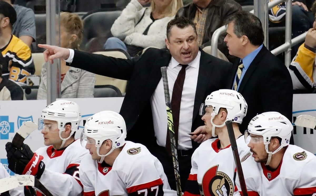 Mar 20, 2023; Pittsburgh, Pennsylvania, USA;  Ottawa Senators head coach D.J. Smith (left) talks with associate coach Jack Capuano (right) on the bench against the Pittsburgh Penguins at PPG Paints Arena.