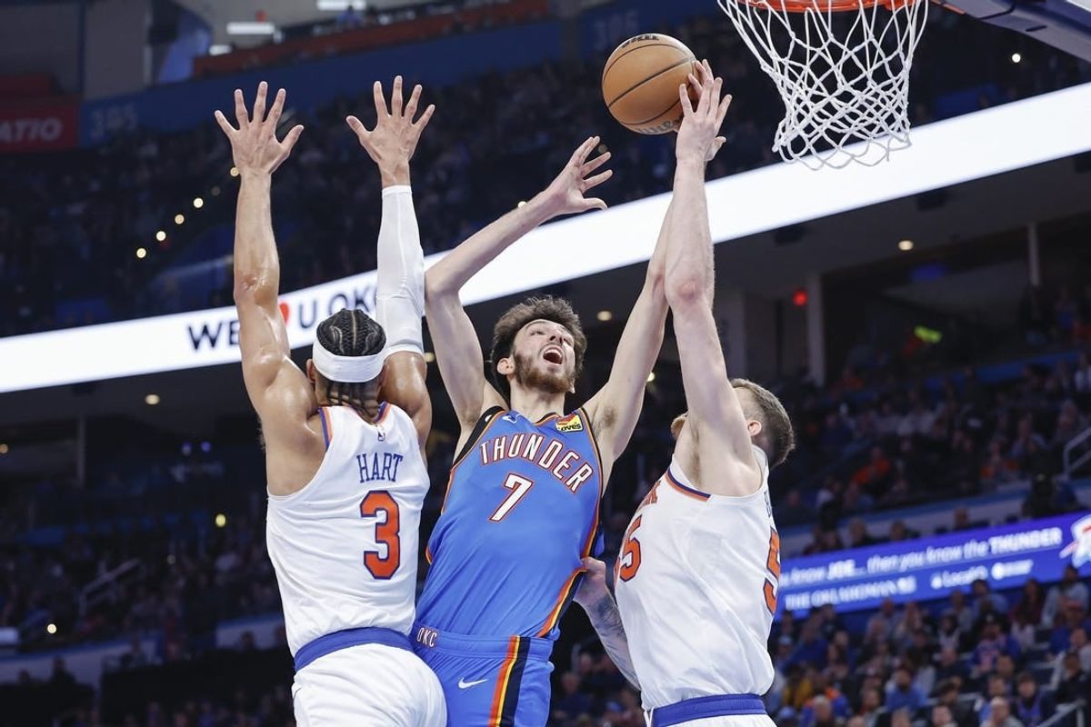 Dec 27, 2023; Oklahoma City, Oklahoma, USA; Oklahoma City Thunder forward Chet Holmgren (7) shoots between New York Knicks guard Josh Hart (3) and center Isaiah Hartenstein (55) during the second half at Paycom Center.