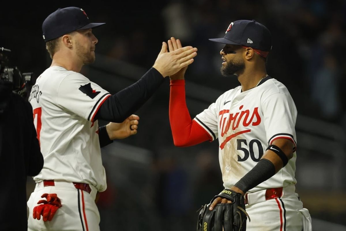 Apr 24, 2024; Minneapolis, Minnesota, USA; Minnesota Twins catcher Ryan Jeffers (27) and shortstop Willi Castro (50) celebrate the win over the Chicago White Sox at Target Field.