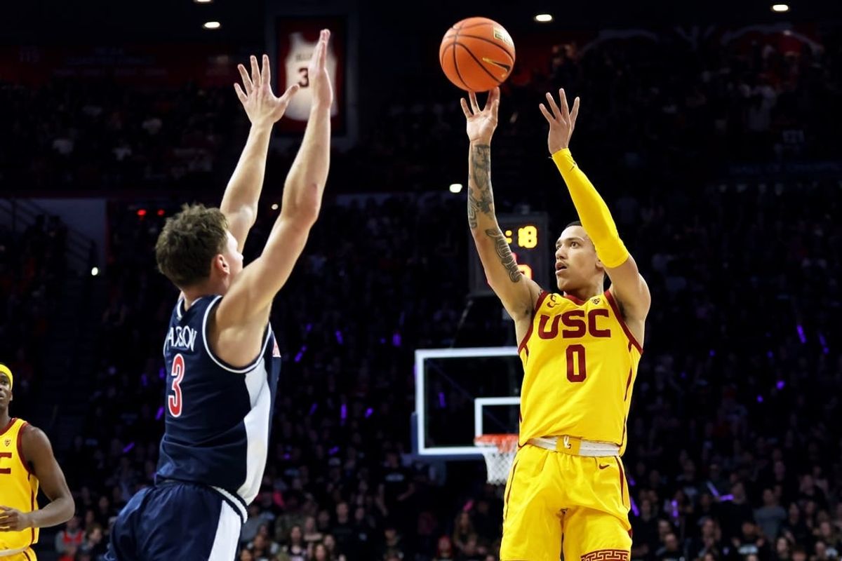 Jan 17, 2024; Tucson, Arizona, USA; USC Trojans guard Kobe Johnson (0) shoots a basket against Arizona Wildcats guard Pelle Larsson (3) during the first half at McKale Center.