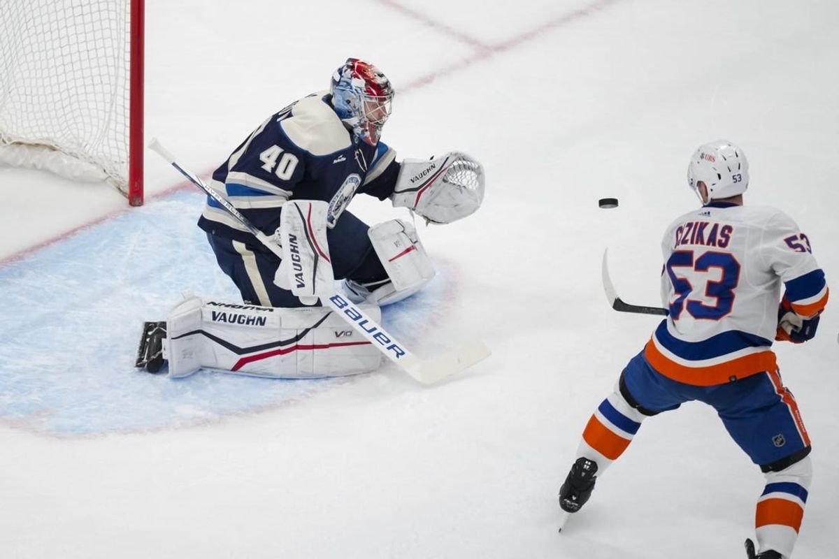 Apr 4, 2024; Columbus, Ohio, USA;  Columbus Blue Jackets goaltender Daniil Tarasov (40) makes a save in net against New York Islanders center Casey Cizikas (53) in the first period at Nationwide Arena.