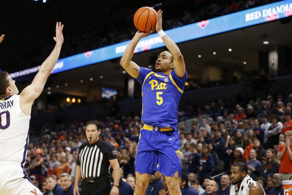 Feb 13, 2024; Charlottesville, Virginia, USA; Pittsburgh Panthers guard Ishmael Leggett (5) shoots the ball over Virginia Cavaliers guard Taine Murray (10) during the first half at John Paul Jones Arena.