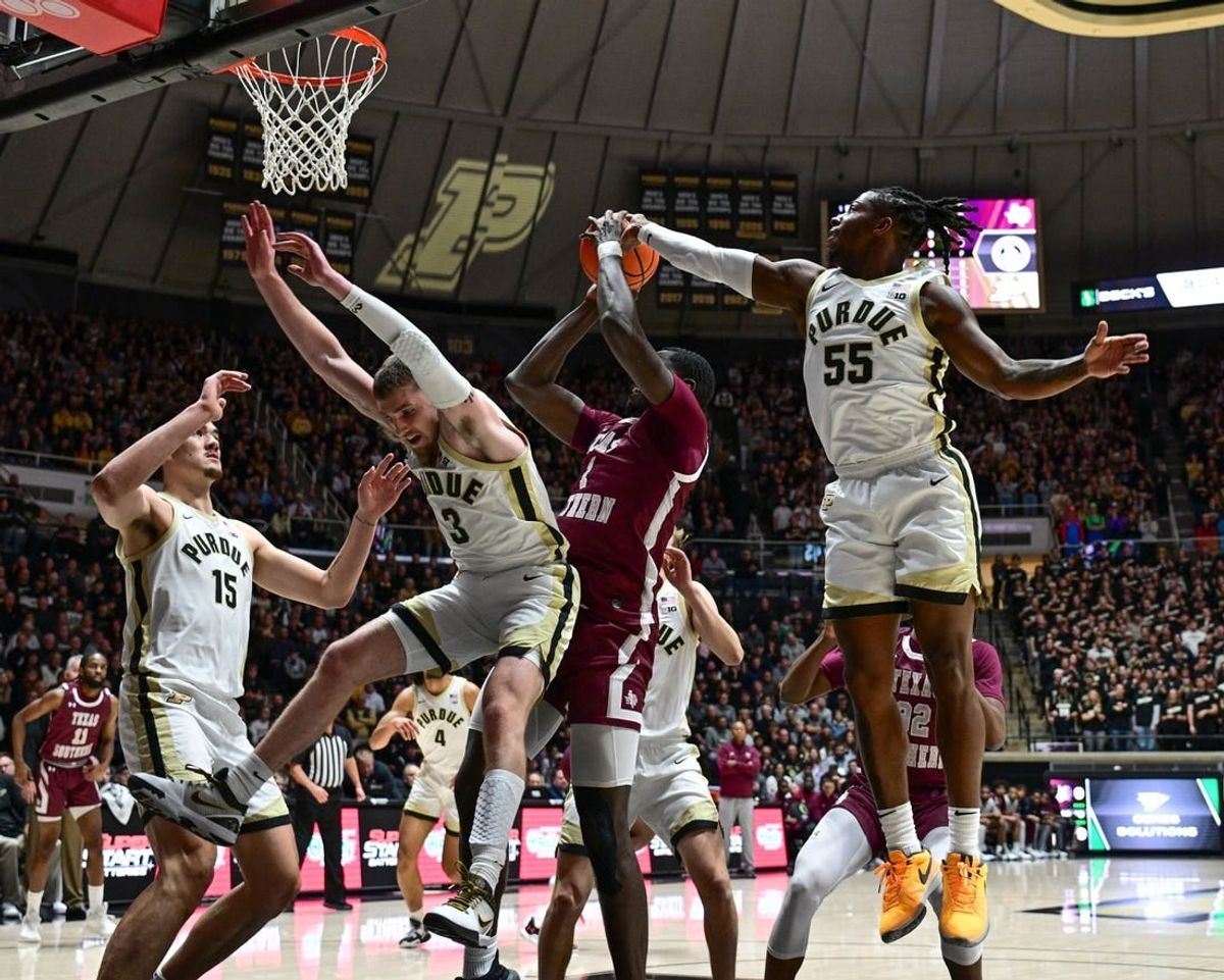 Nov 28, 2023; West Lafayette, Indiana, USA; Purdue Boilermakers guard Lance Jones (55) blocks a shot by Texas Southern Tigers forward Jahmar Young Jr. (2) during the first half at Mackey Arena.