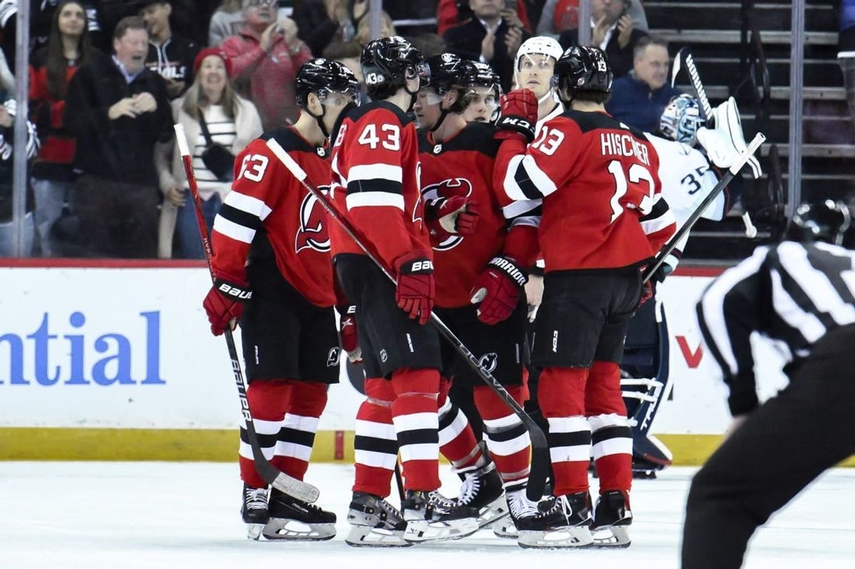 Feb 12, 2024; Newark, New Jersey, USA; New Jersey Devils right wing Tyler Toffoli (73) celebrates with teammates after scoring a goal against the Seattle Kraken during the first period at Prudential Center.