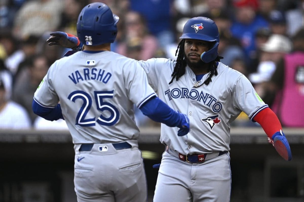 Apr 20, 2024; San Diego, California, USA; Toronto Blue Jays left fielder Daulton Varsho (25) is congratulated by first baseman Vladimir Guerrero Jr. (right) after hitting a three-run home run against the San Diego Padres during the first inning at Petco Park.